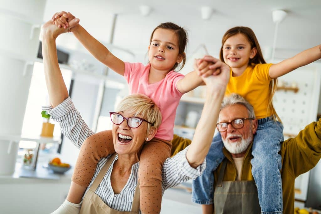 Portrait of happy elderly couple and grandchildren playing together » Borja Physical Therapy And Weight Loss Clinic Play With Your Grandkids